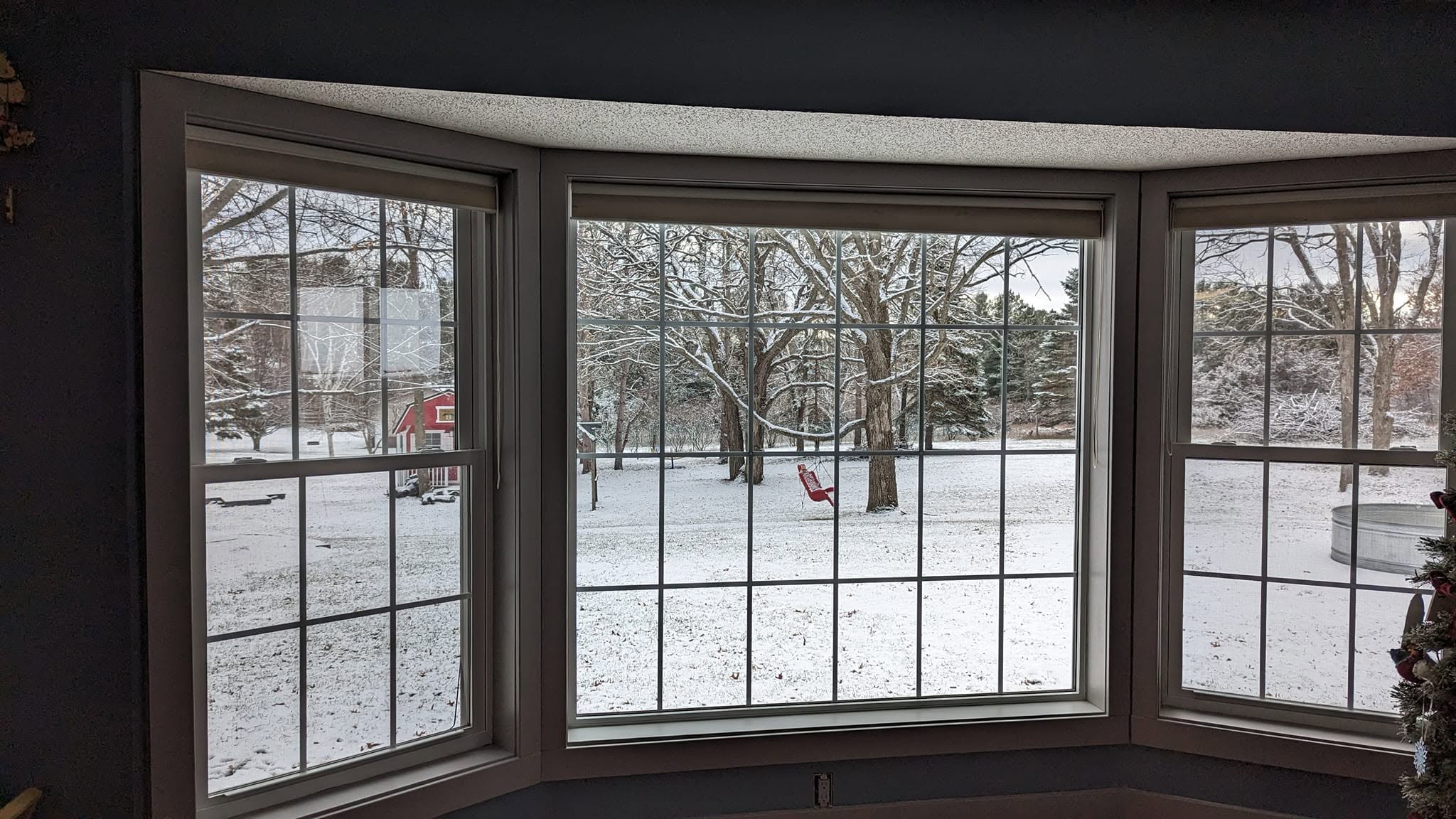 A finished window frame in crisp trim against a winter view