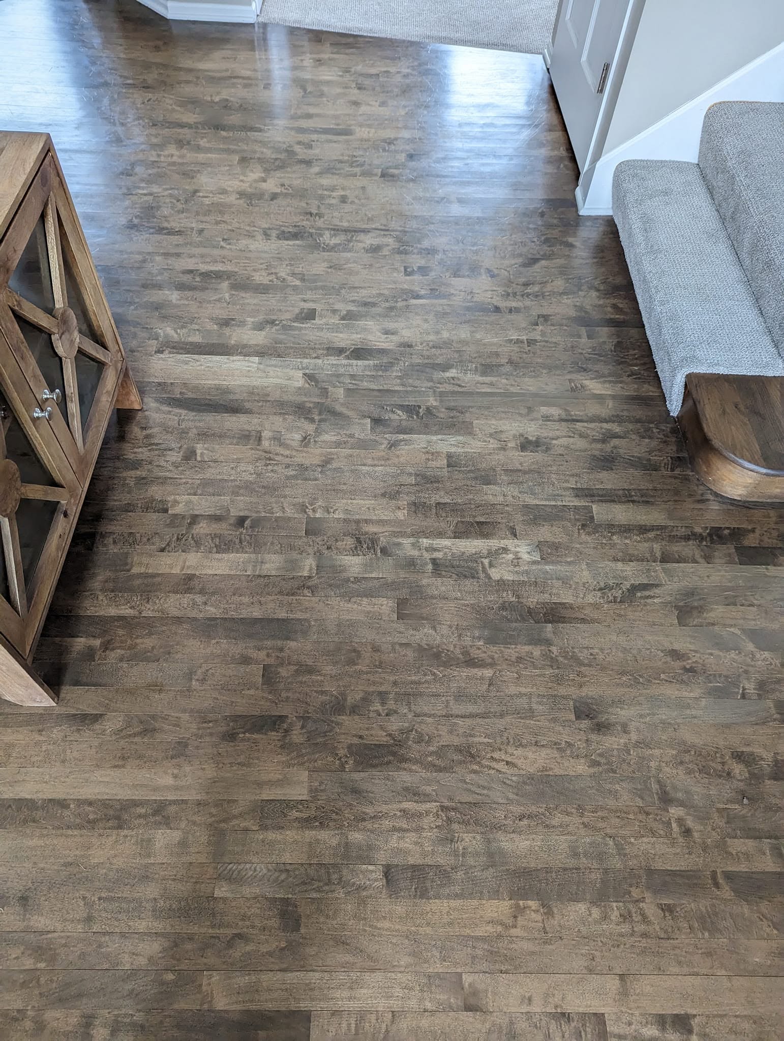 A beautifully finished floor in weathered plank, installed wall to wall