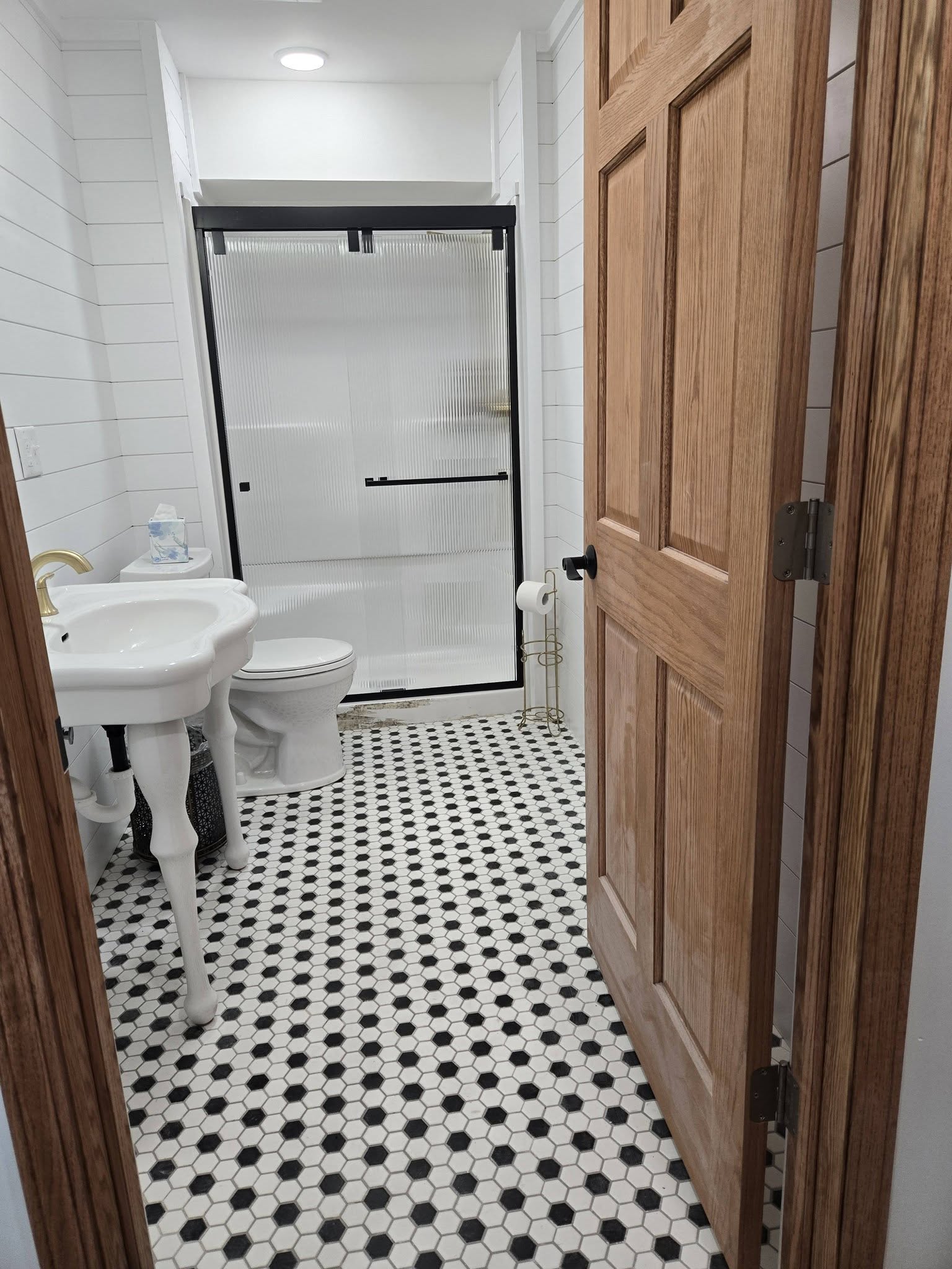 A finished bathroom with vanity and custom door trim