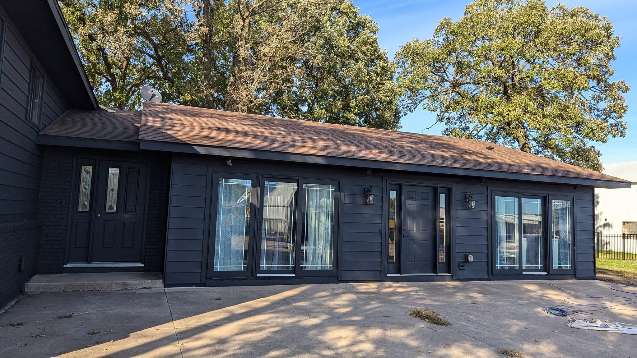 A home we finished in deep charcoal shiplap, set among the trees in Sherburne County