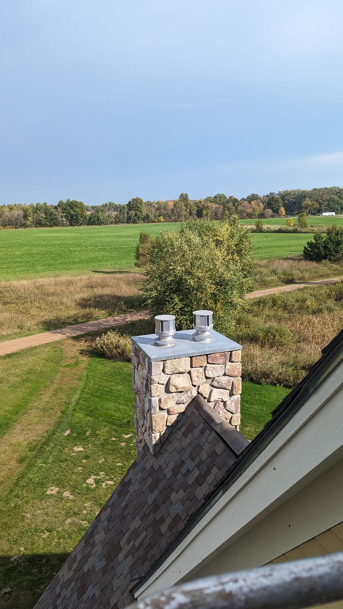 A stone chimney we built up through the gable of a home